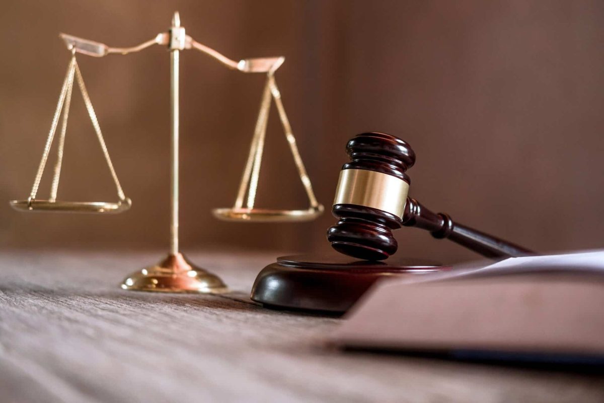 Scales of justice and Gavel on wooden table and agreement in Courtroom, Justice and Law concept.